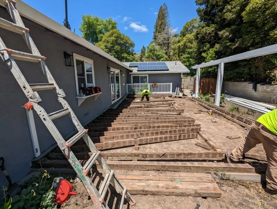 Deck boards pulled up to the joists during a deck removal